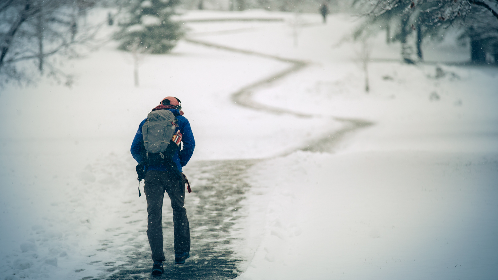 A student begins the long ascent up Libe Slope after a fresh snowfall