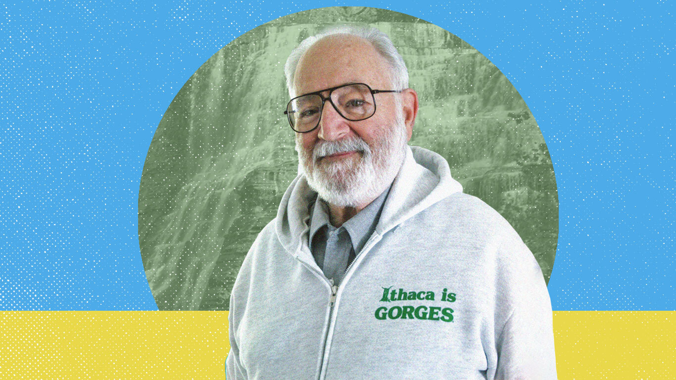 A photo of a man with a white beard and glasses wearing an "Ithaca is Gorges" hoodie