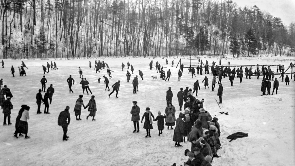 dozens of skaters are pictured ice skating on Beebe Lake in the early 1900s