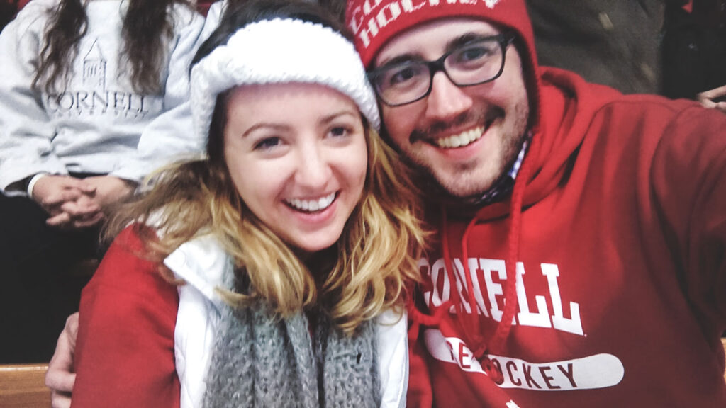 a couple in Cornell hockey fan garb