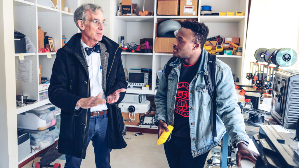 Bill Nye chats about details of the solar noon clock with Smith Charles ’23, one of the engineering students who worked on the project to revamp the controller and its software
