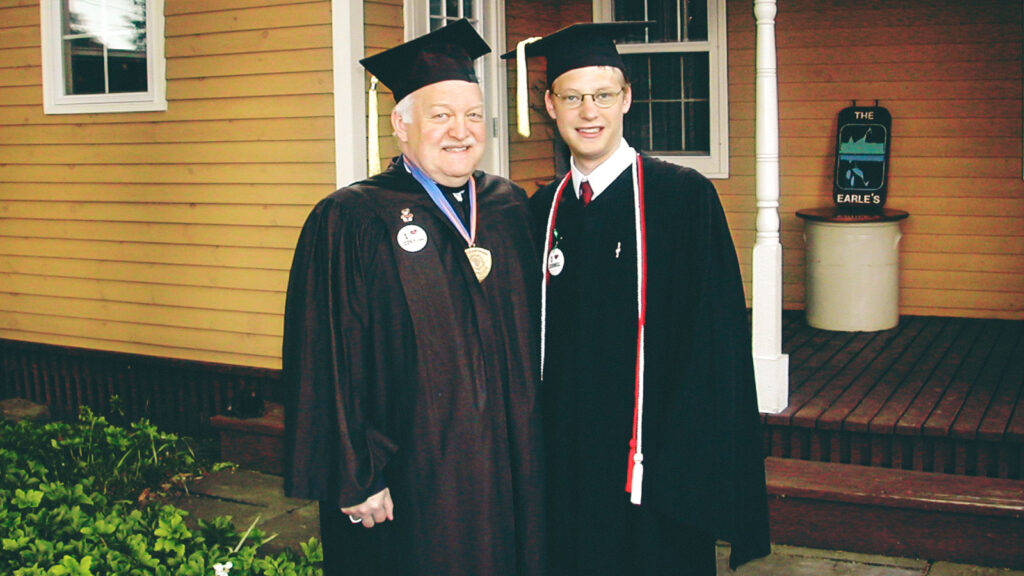Corey and Brian Earle in commencement robes
