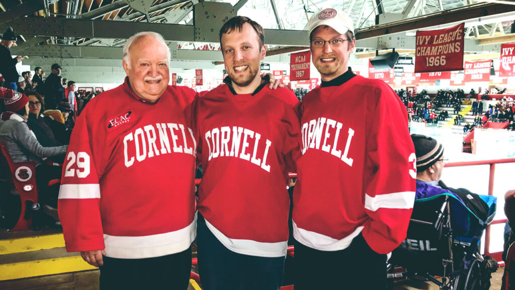 Brian, Evan, and Corey Earle at a hockey game