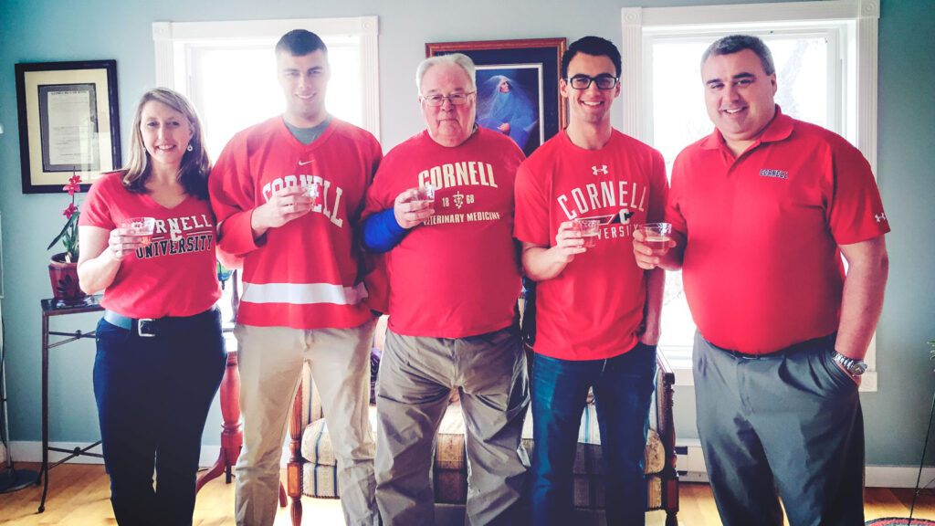 Katrina, Jonathan, Dick, Taylor, and Tom Overton wear red Cornell shirts to celebrate Taylor being accepted into the Class of 2022