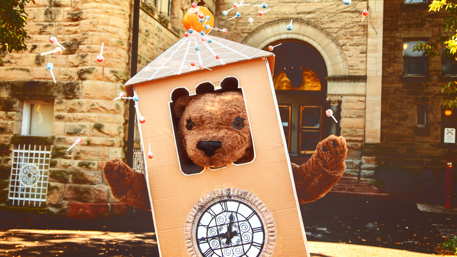 Dressed as a "mini-me" McGraw Tower, Touchdown trick-or-treats around Ho Plaza