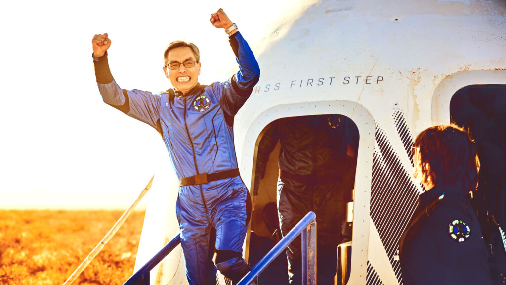 Gary Lai exits the Blue Origin capsule following its successful suborbital flight March 31