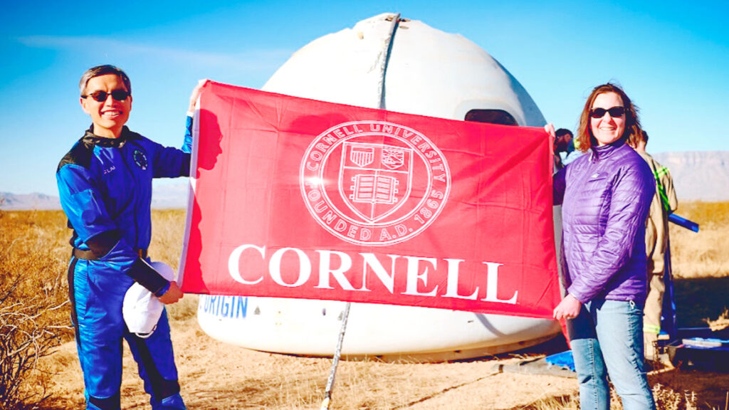 Following the March flight and successful landing, Lai was met by his wife, Natalya Yudkovsky ’96, right, to display a Cornell flag