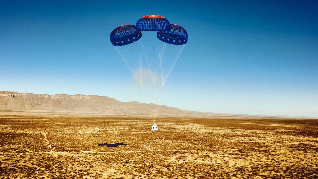 The Blue Origin New Shepard capsule parachutes to a soft landing following the suborbital flight