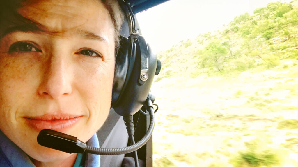 Meredith on a helicopter-based patrol with wildlife rangers