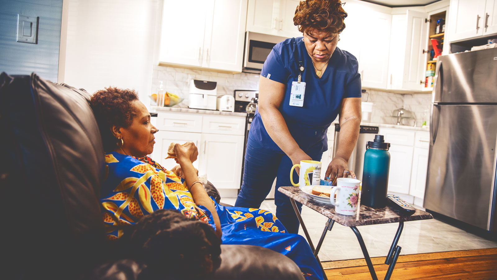 A home health aide caring for a patient