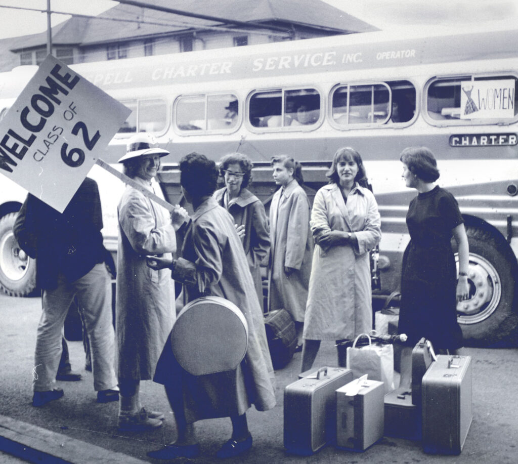 First-year students arriving by bus are welcomed to freshman registration on campus in 1958