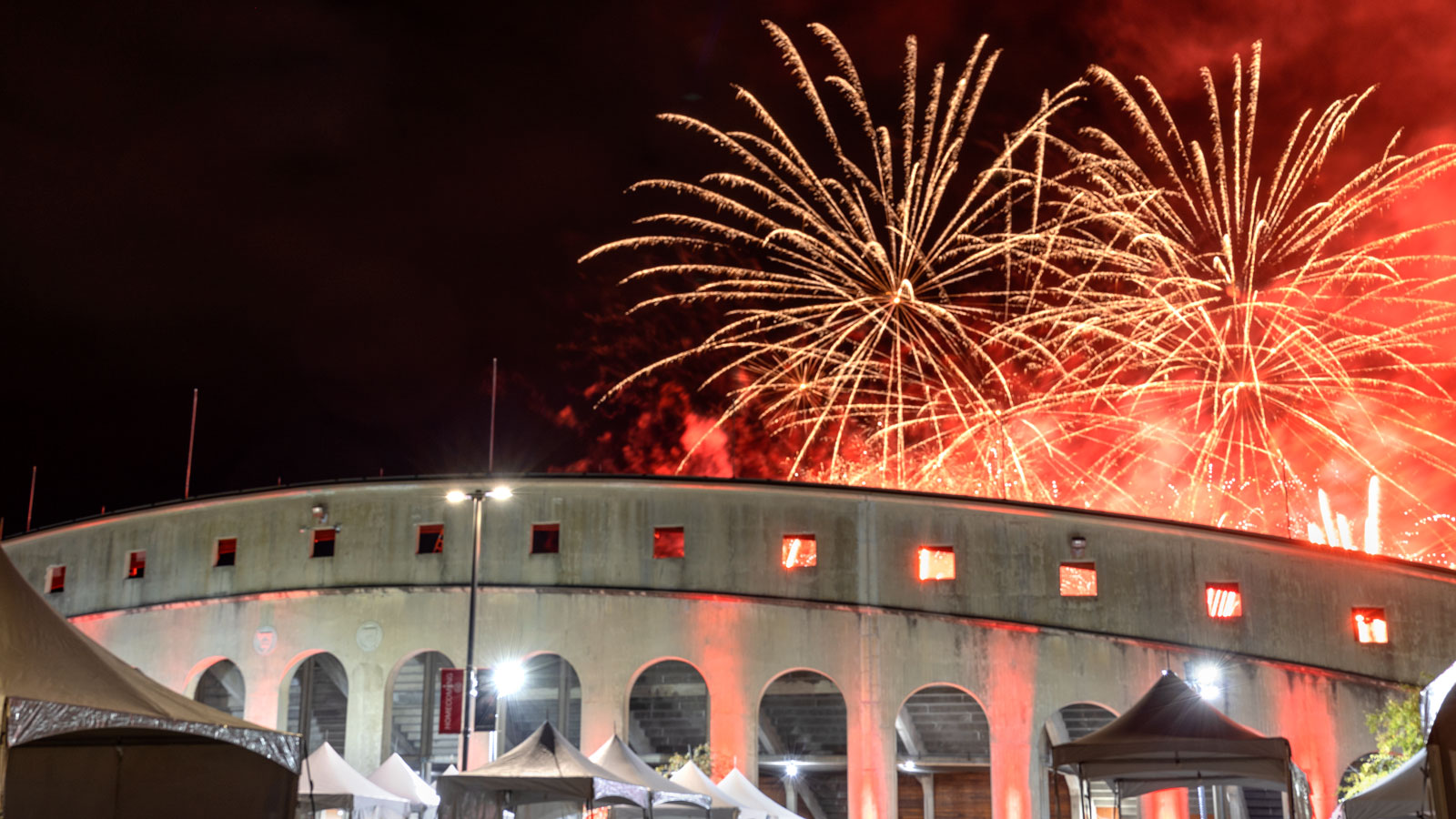 The Homecoming fireworks display is visible above Schoellkopf Stadium