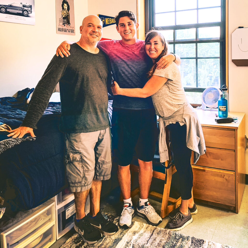 Brad and Amy Herzog with son Jesse in his freshman dorm room