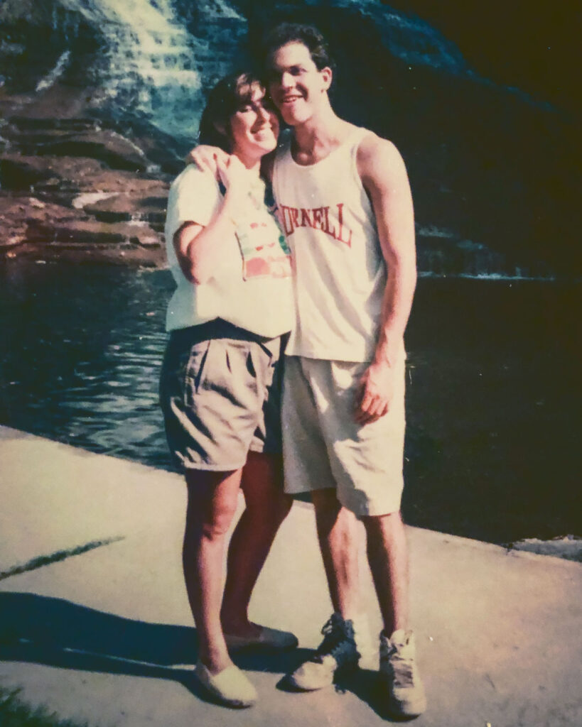 Brad and Amy Herzog in front of a waterfall as college students