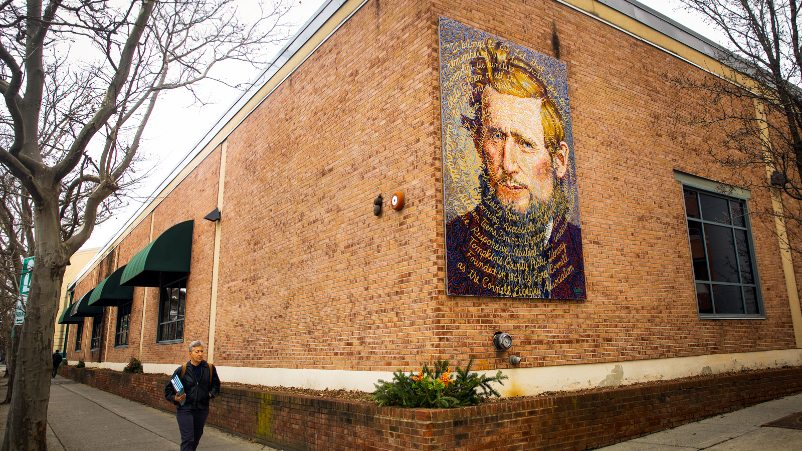 Ezra mural outside Tompkins County Public Library in Ithaca