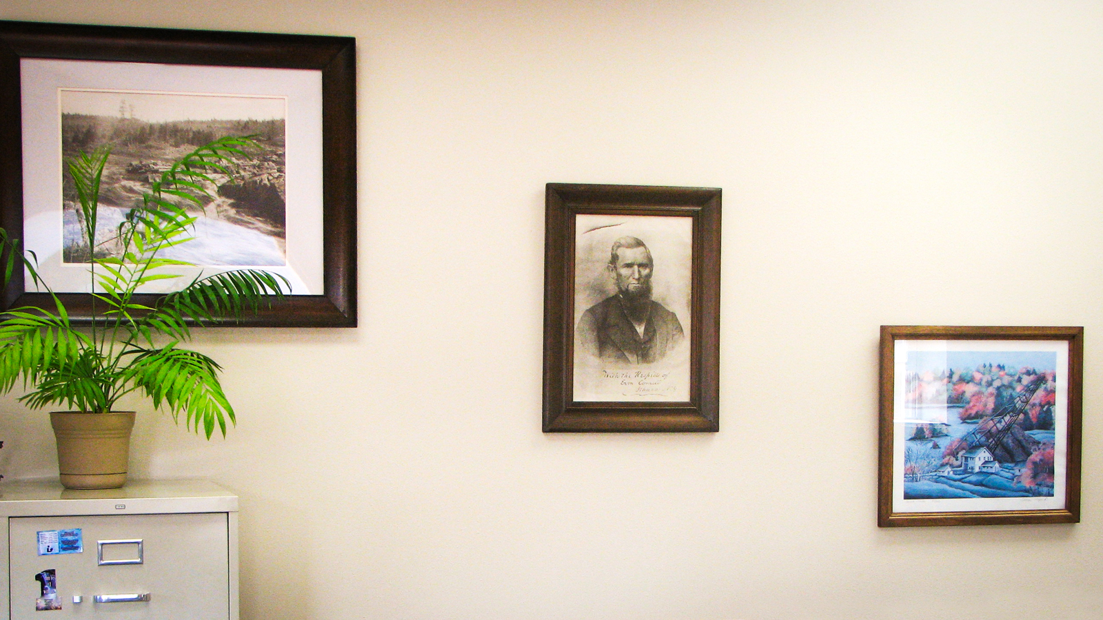 A signed lithograph of Ezra Cornell hangs on the wall of the city hall office in Cornell, Wisconsin