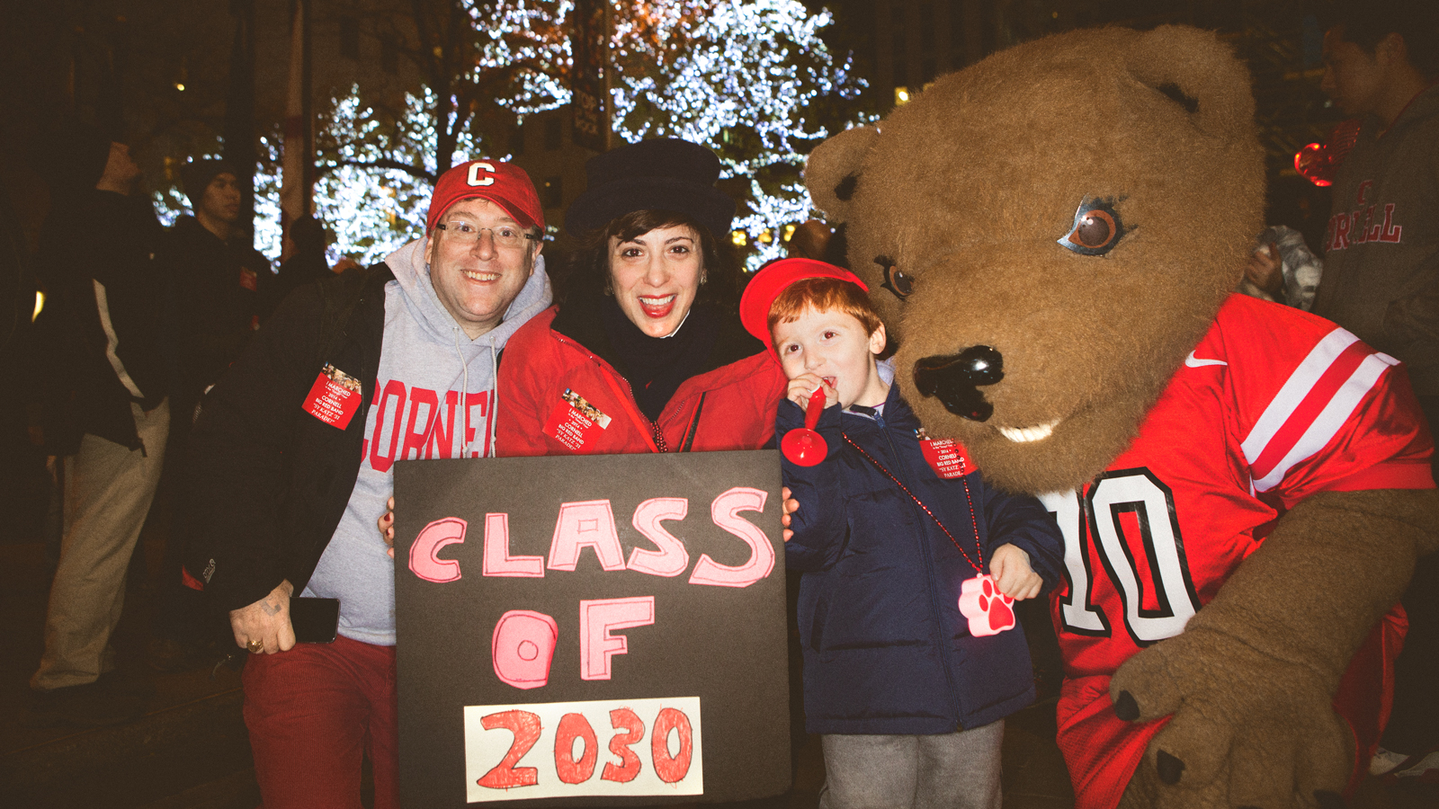 Cornell fans and Cornell mascot Touchdown pose for a picture at the Sy Katz Parade in New York City