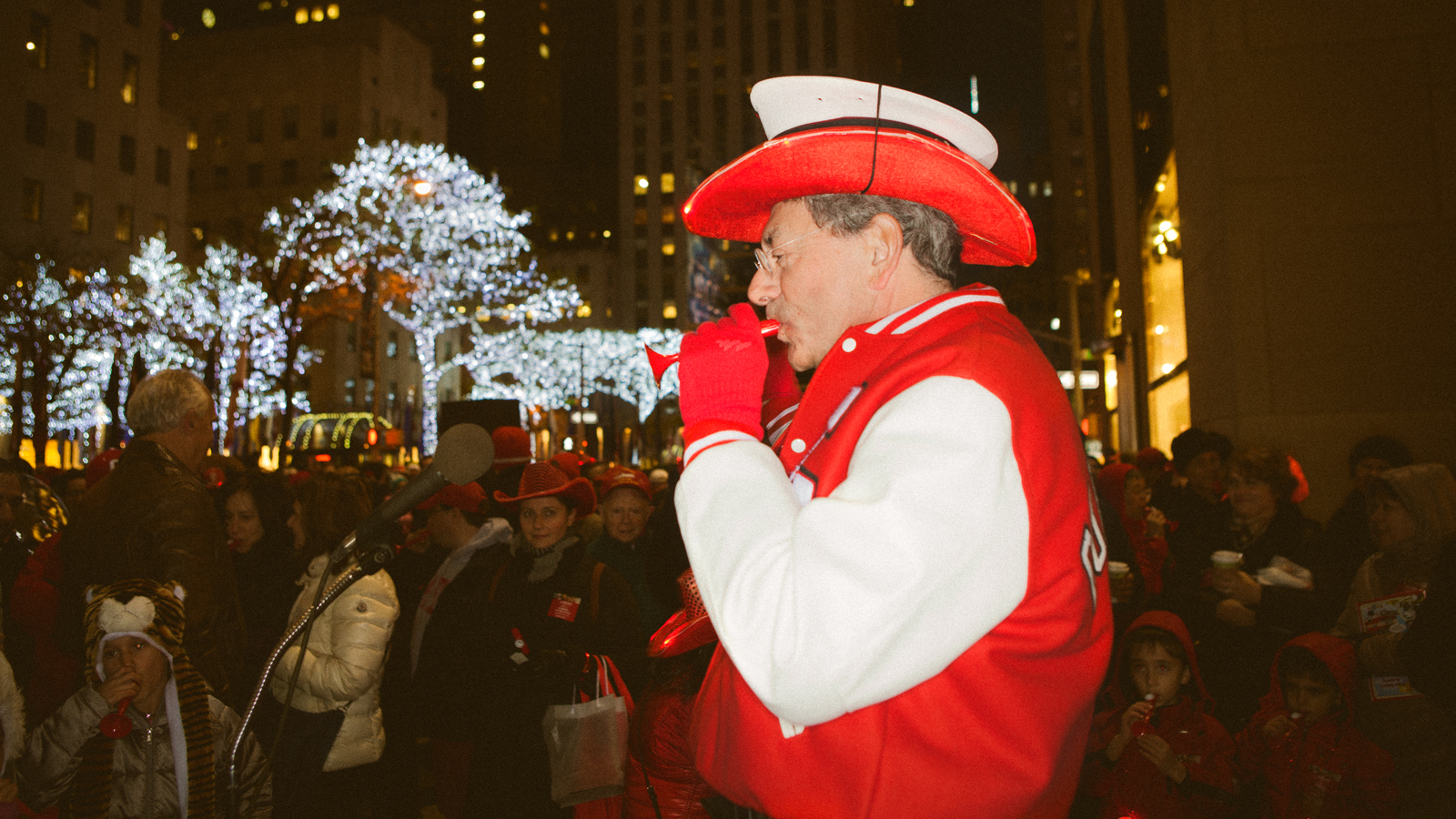 Cornell fan plays a kazoo during the Sy Katz Parade in New York City