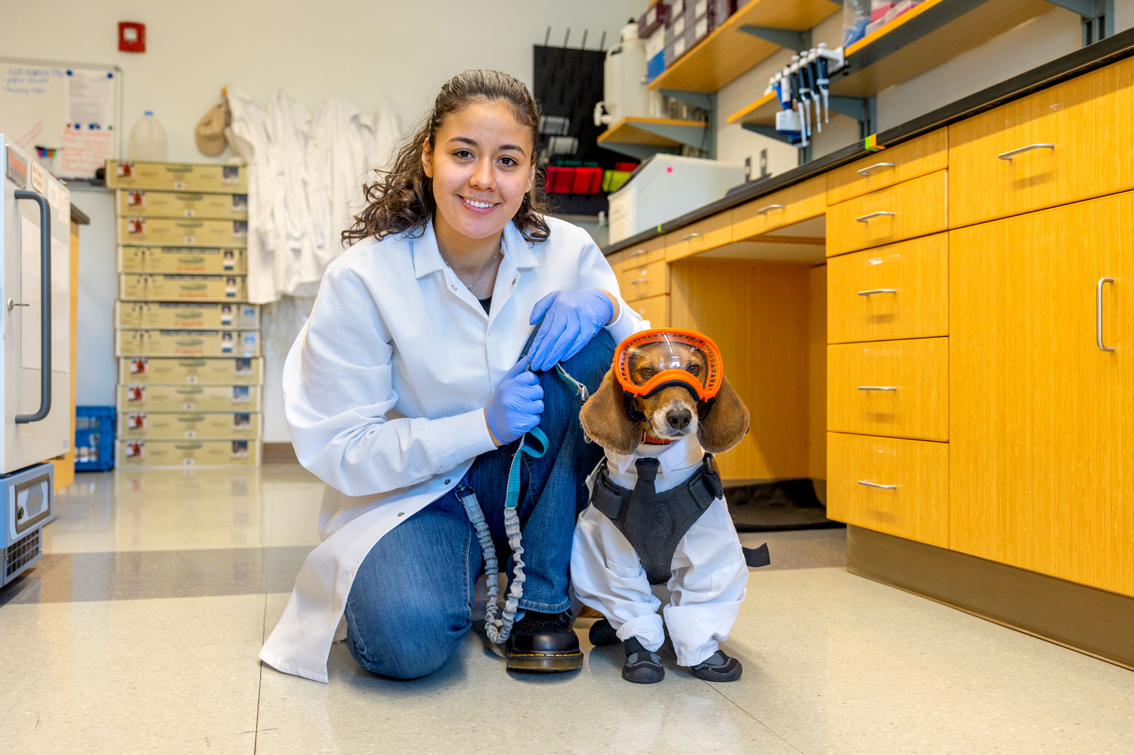Genesis Contreras and her service dog in the lab