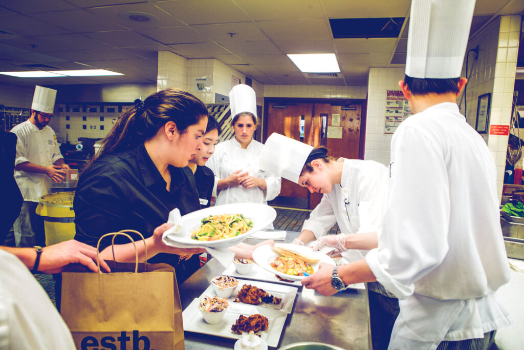 Student teams prepare orders during the Establishment (restaurant management) course in 2015
