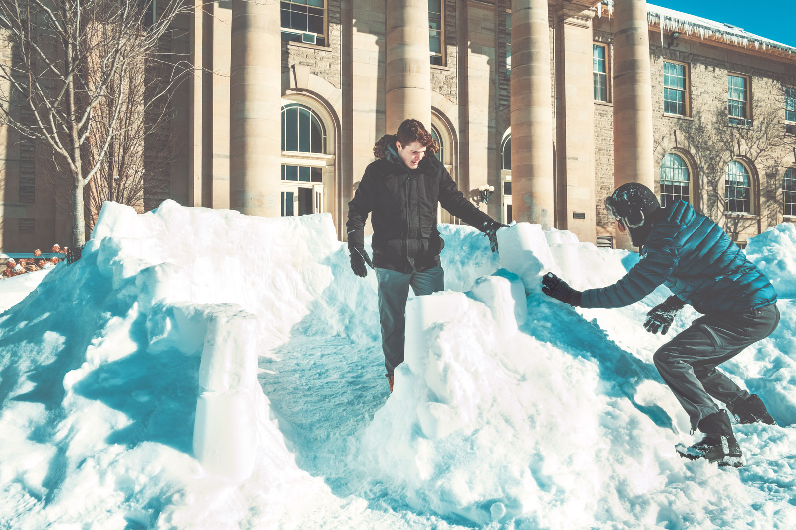 Students build a snow fort in front of Goldwin Smith Hall