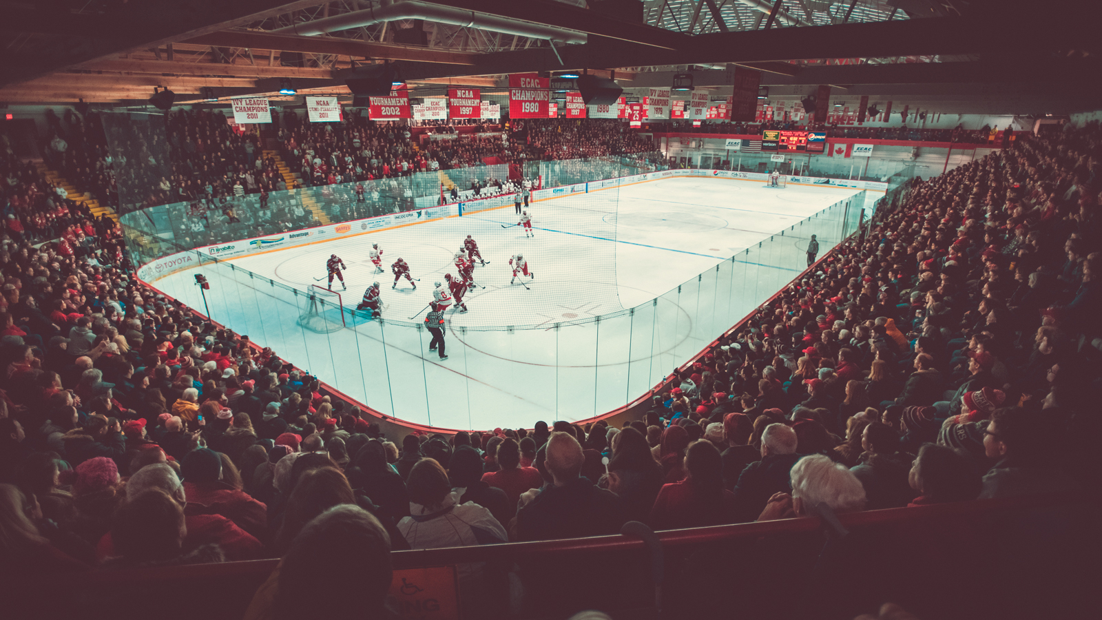 A men's ice hockey match between Cornell and Harvard at Lynah Rink at Cornell University