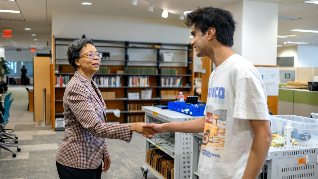 University Librarian Elaine Westbrooks meets Library Assistant Amerdeep Passananti, Class of ’25, in Mann Library