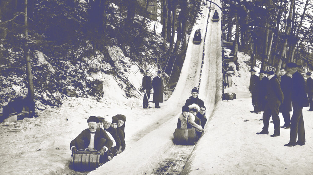 Riders descend the toboggan slide in the early 1900s