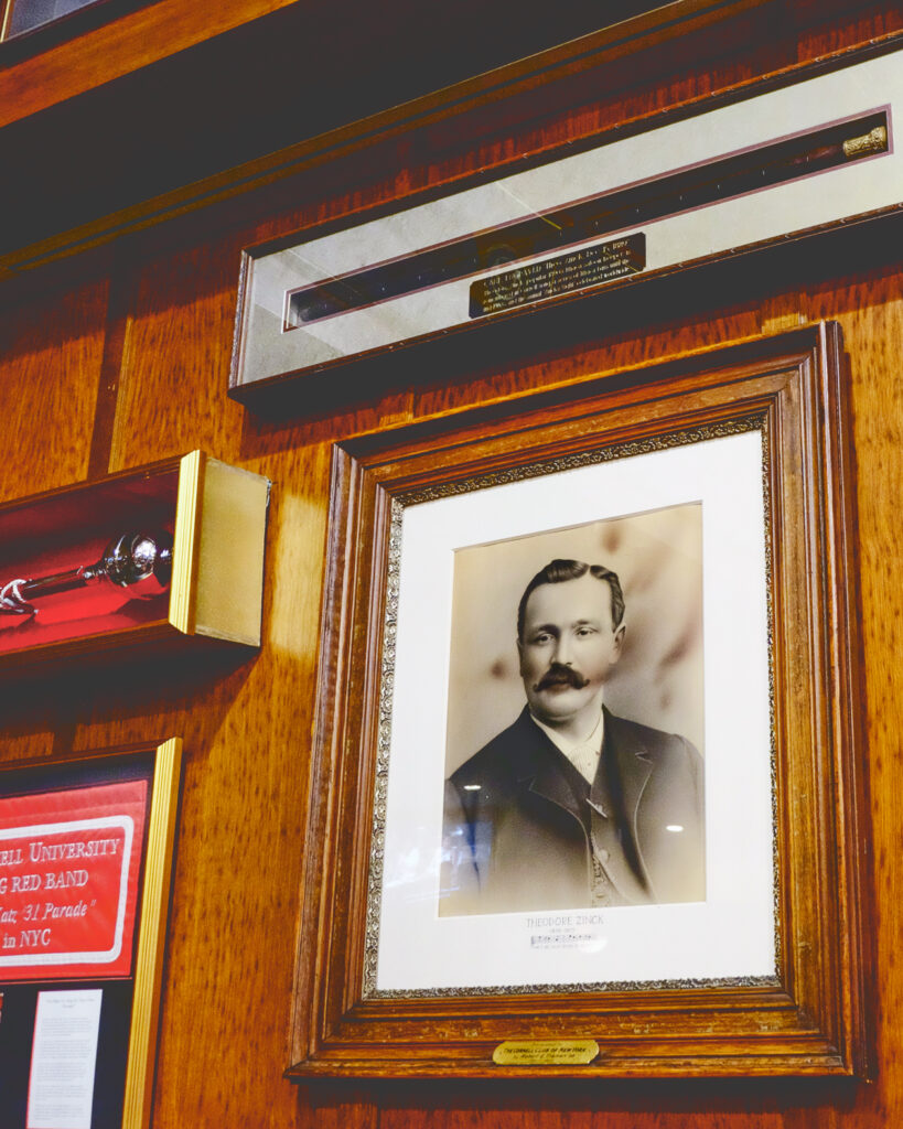 A portrait of famed Ithaca barkeep Theodore Zinck, as well as his engraved cane, are on display on the club’s walls
