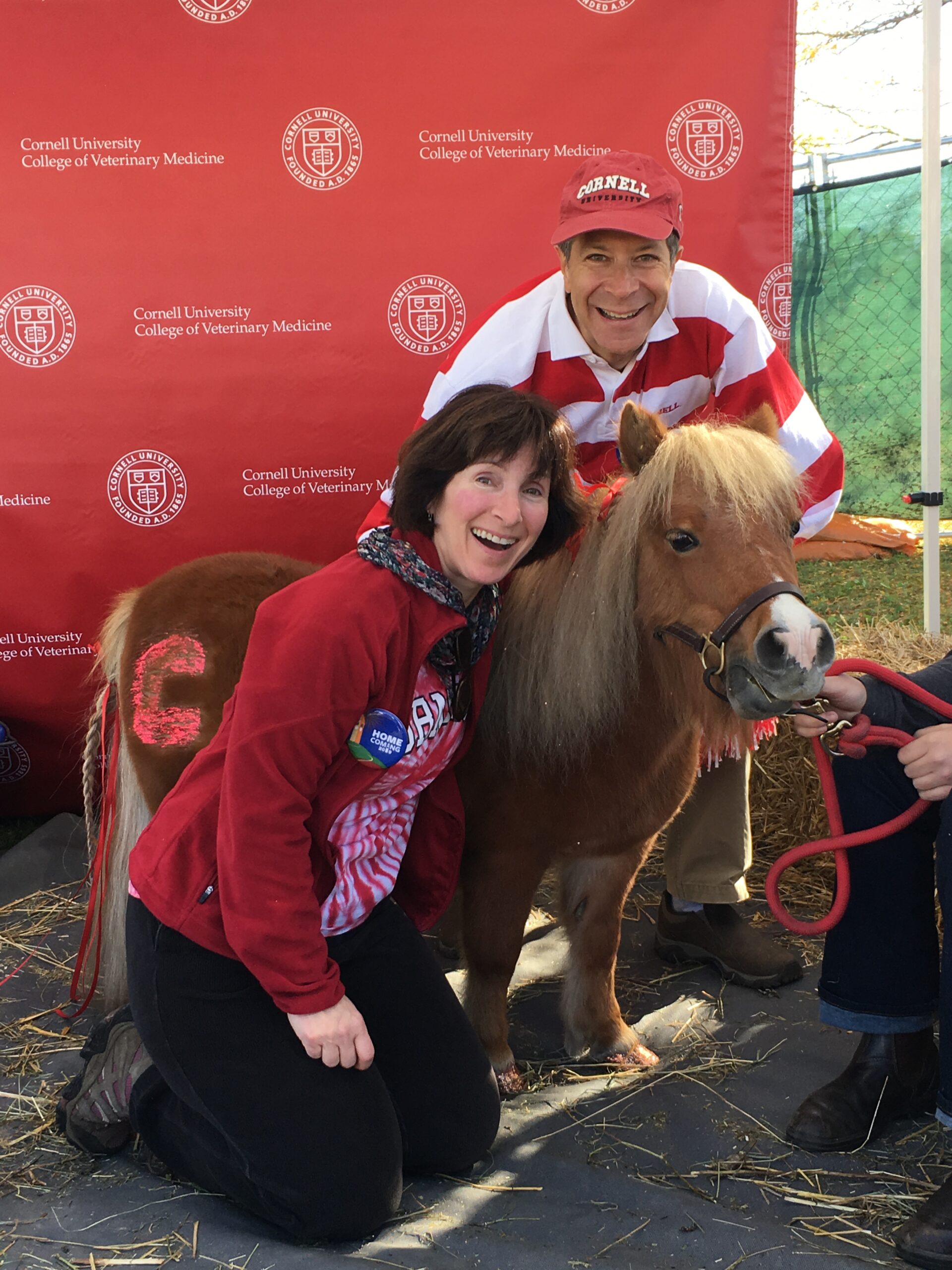 Adrienne McVicker Reing ’87 and Charles Reing ’86 with Minnie the Miniature Horse