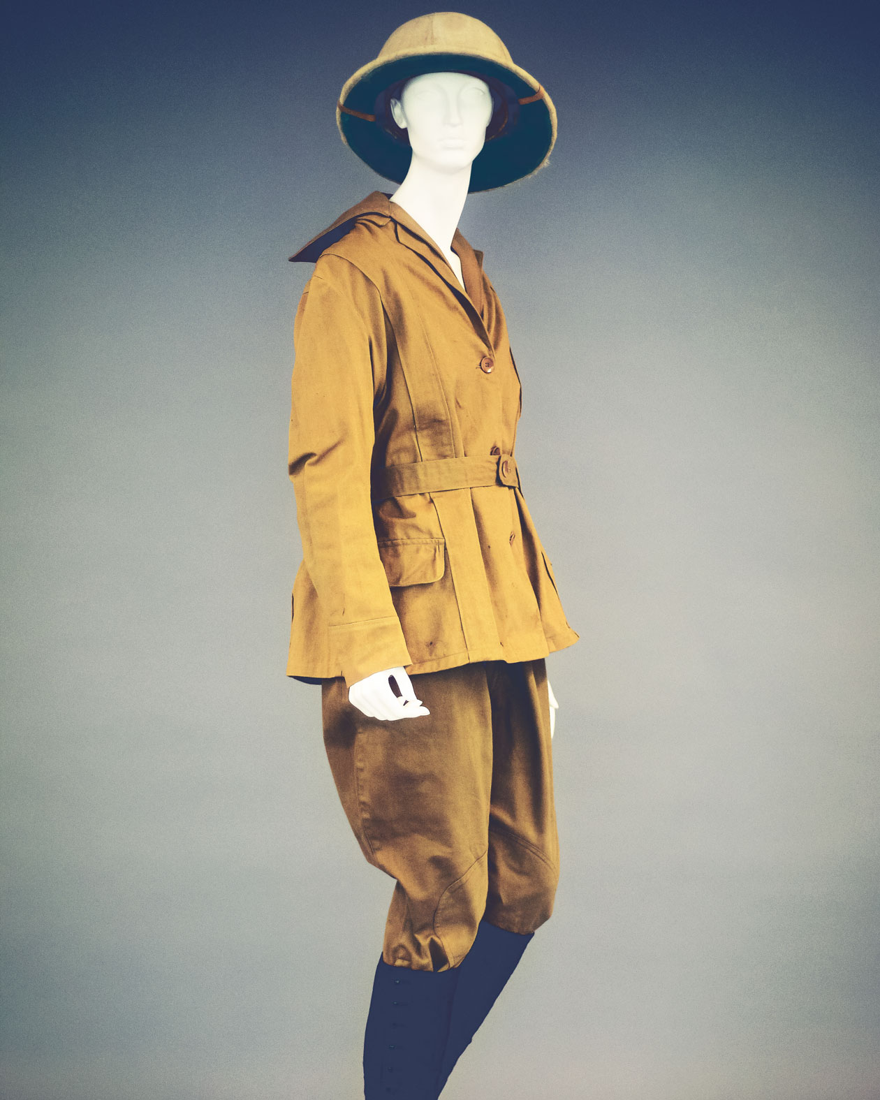 A tan coat, pants and hat worn by a 1915 researcher on an excursion.