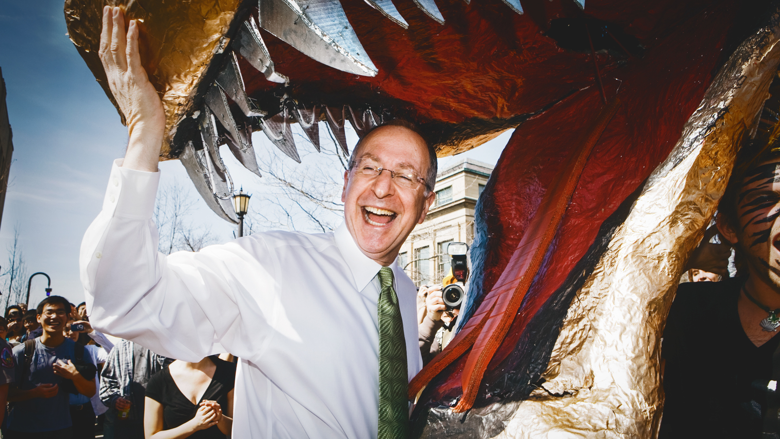 Then-president David Skorton poses in the mouth of the dragon in 2010