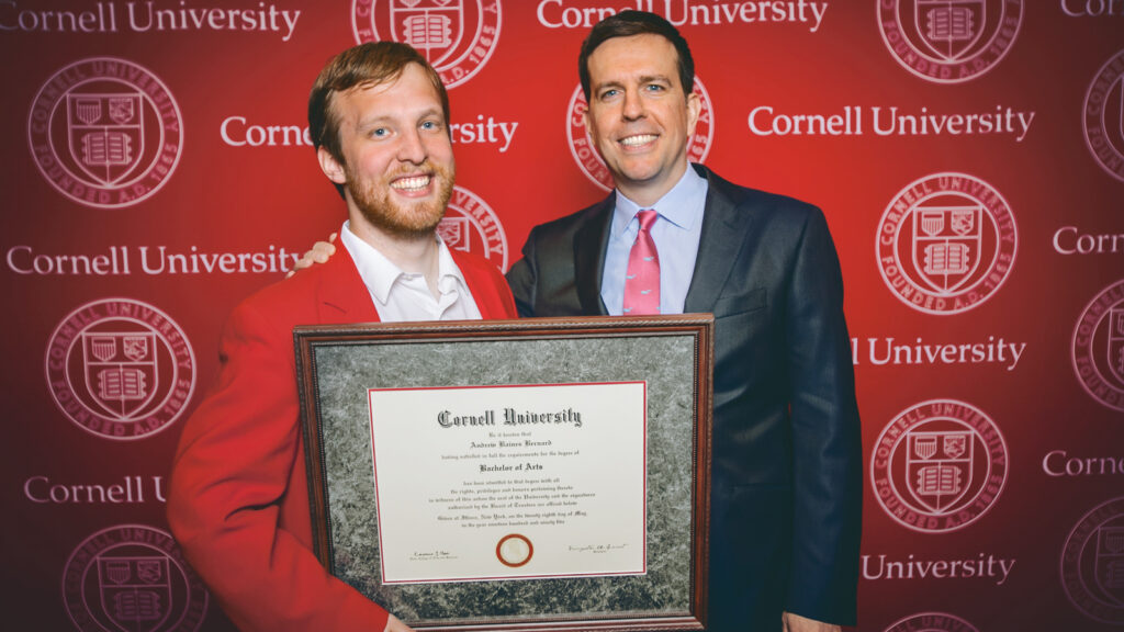 Corey Earle and Ed Helms with a faux Cornell diploma