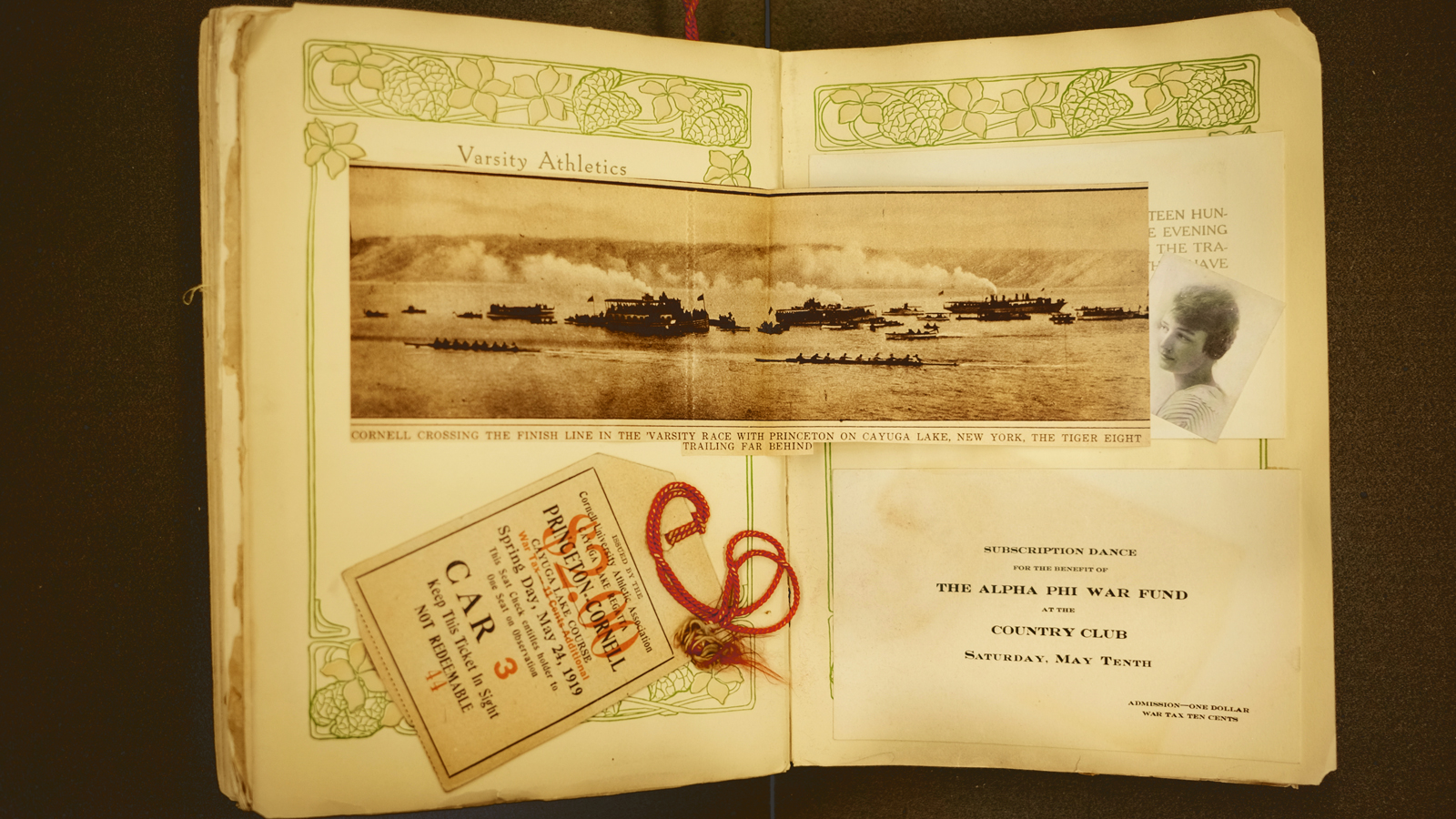 A newspaper photo from a victorious crew race against Princeton, and a ticket from the observation train, from a 1919 scrapbook