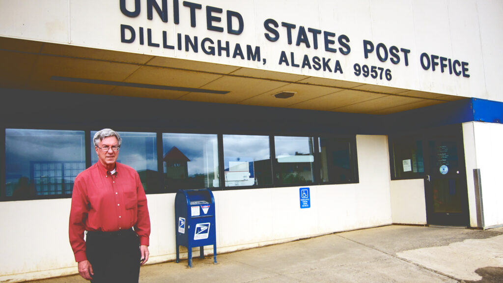 Brian O'Connor standing in from of the post office in Dillingham, AK.