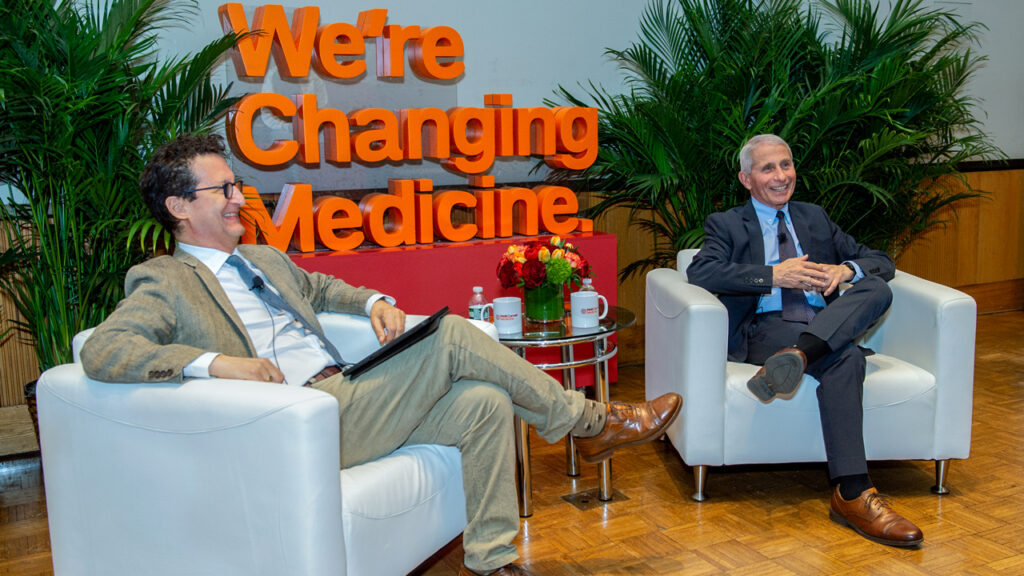 Dr. Anthony Fauci in a chair onstage with Mark Mannucci