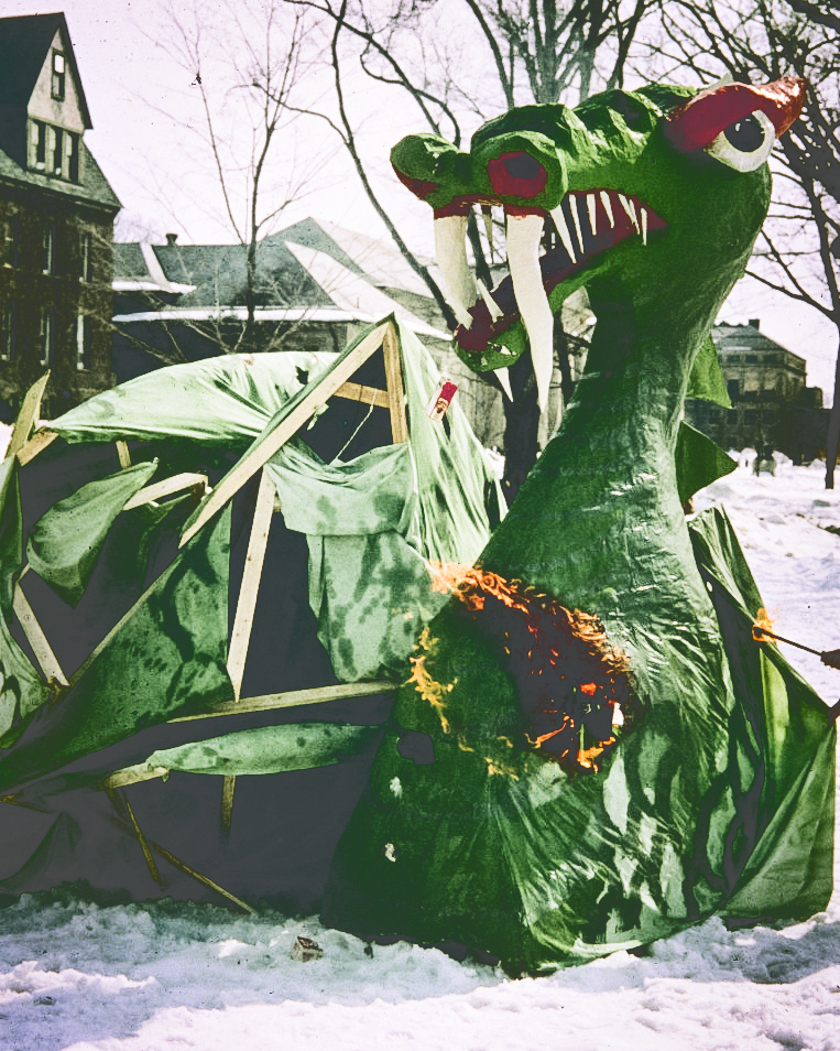 An undated image of a dragon beginning to burn on a snowy Arts Quad following the parade