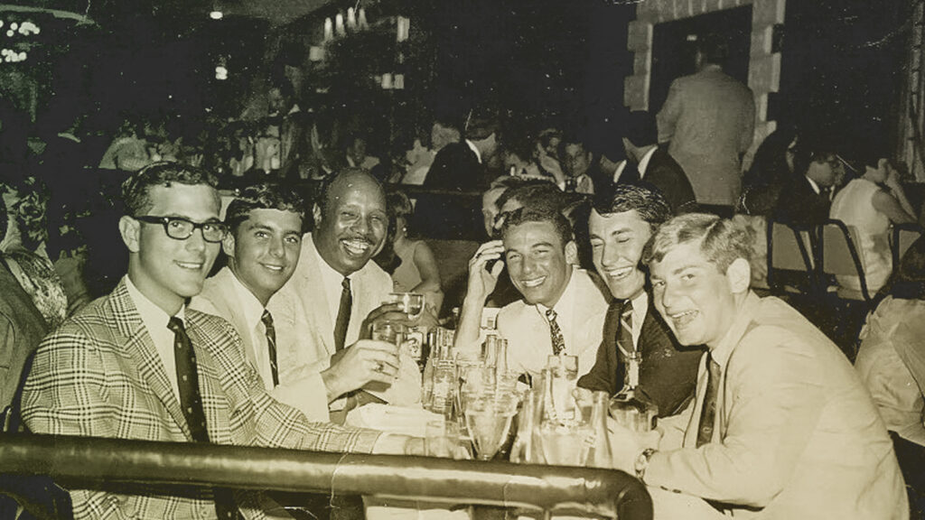 A group of men around a dinner table in the Sixties