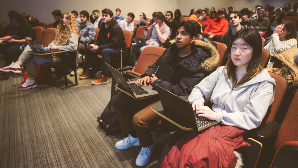 Students learn about making trade-offs over time in the behavioral economics course Better Decisions for Life, Love, and Money in Statler Auditorium