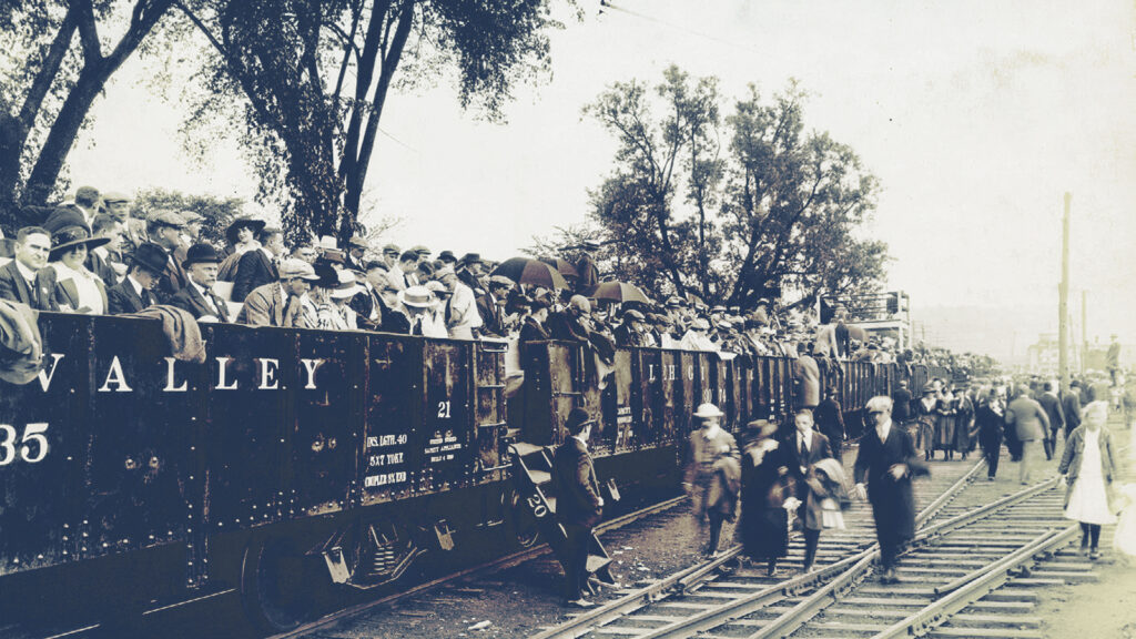 An observation train is loaded in 1920 at the Fulton Street rail yard in downtown Ithaca in advance of crew races