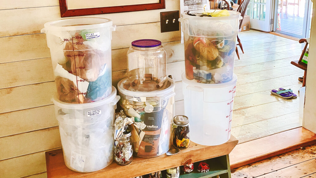 An array of recyclable waste items organized in clear containers