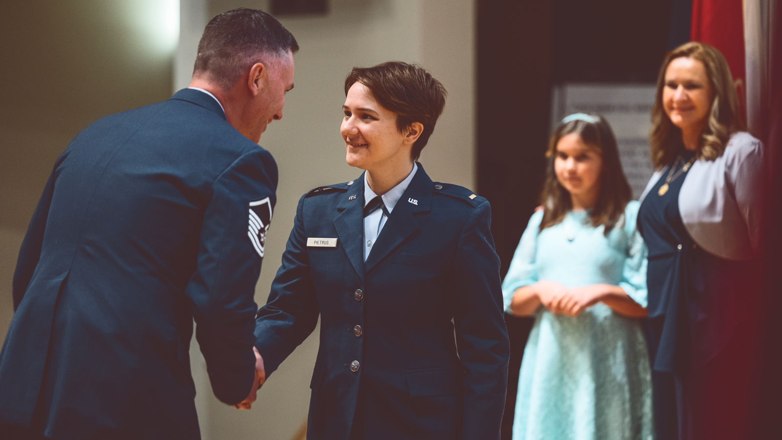 Claudia Pietrus, the first member of Cornell’s ROTC to commission into the U.S. Space Force, is sworn in as her family looks on during the May 26 commissioning ceremony in Alice Statler Auditorium