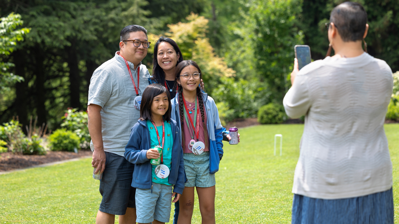 Clement Chow '03 and family pose for a photo at the Botanic Gardens during a reception for Graduate School alumni.