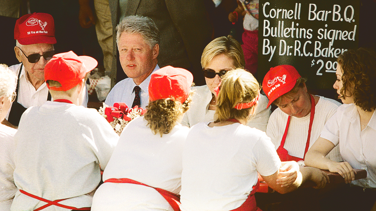 President Bill Clinton sits with Bob Baker at the New York State Fair in 1999; with them is Hillary Clinton and daughter Chelsea at right