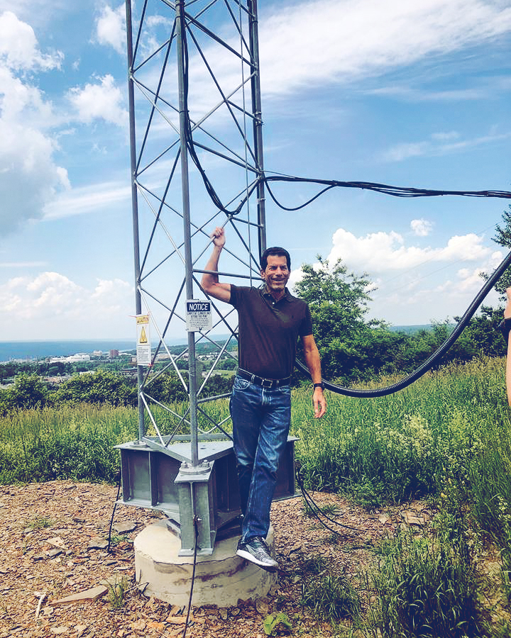 Jon Rubinstein ’78, pictured in 2018 with the new ”Ruby Tower” transmitter