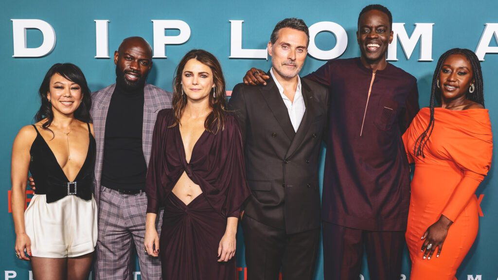 Ato Essandoh and his costars in "The Diplomat" pose on the red carpet.
