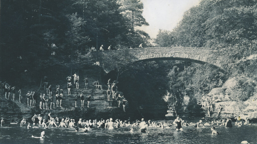 Students swimming at Sackett Bridge in a vintage photo