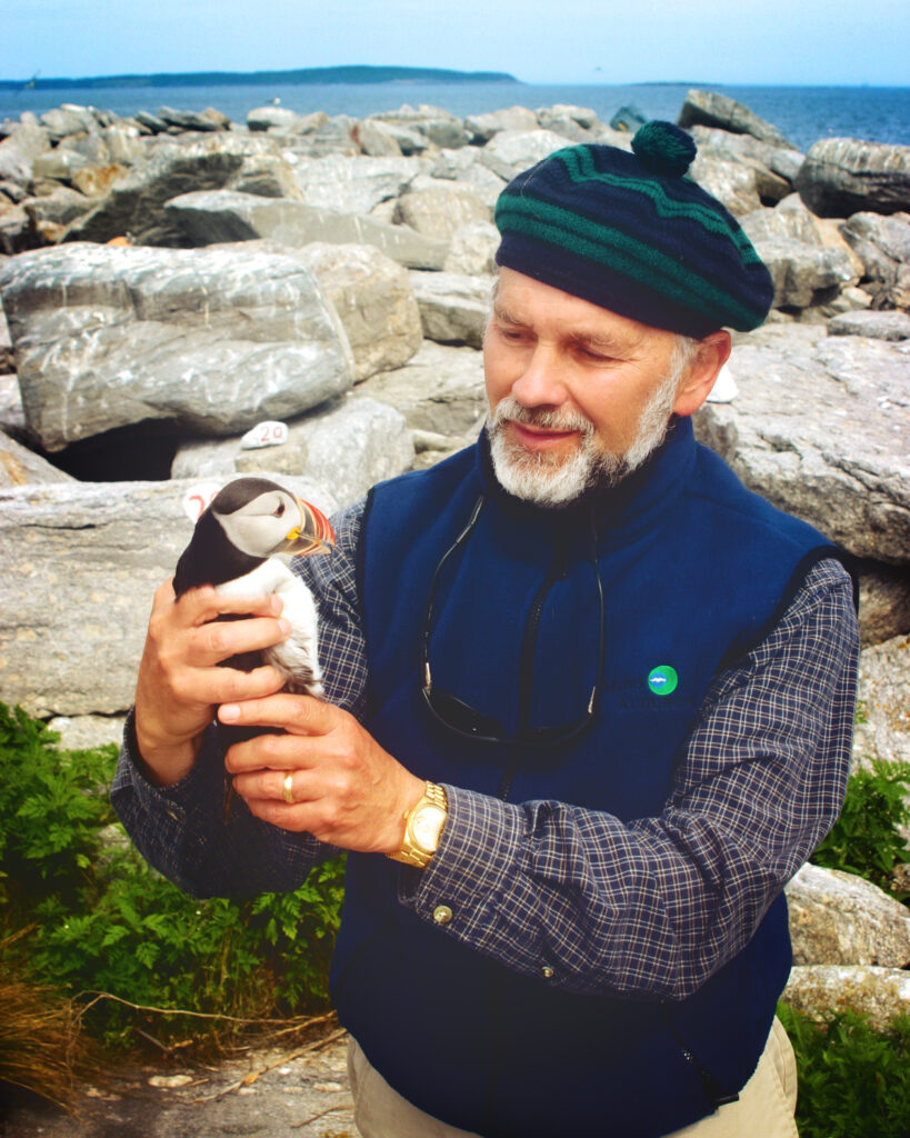 Steve Kress holding a puffin