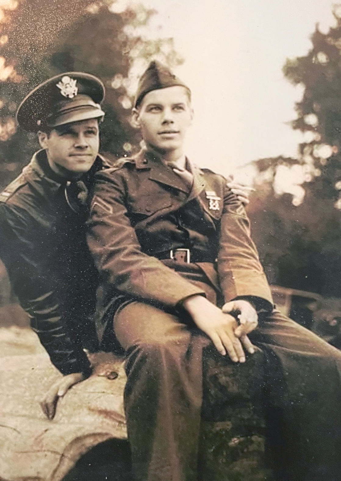 Twin brothers in military uniforms in the 1940s