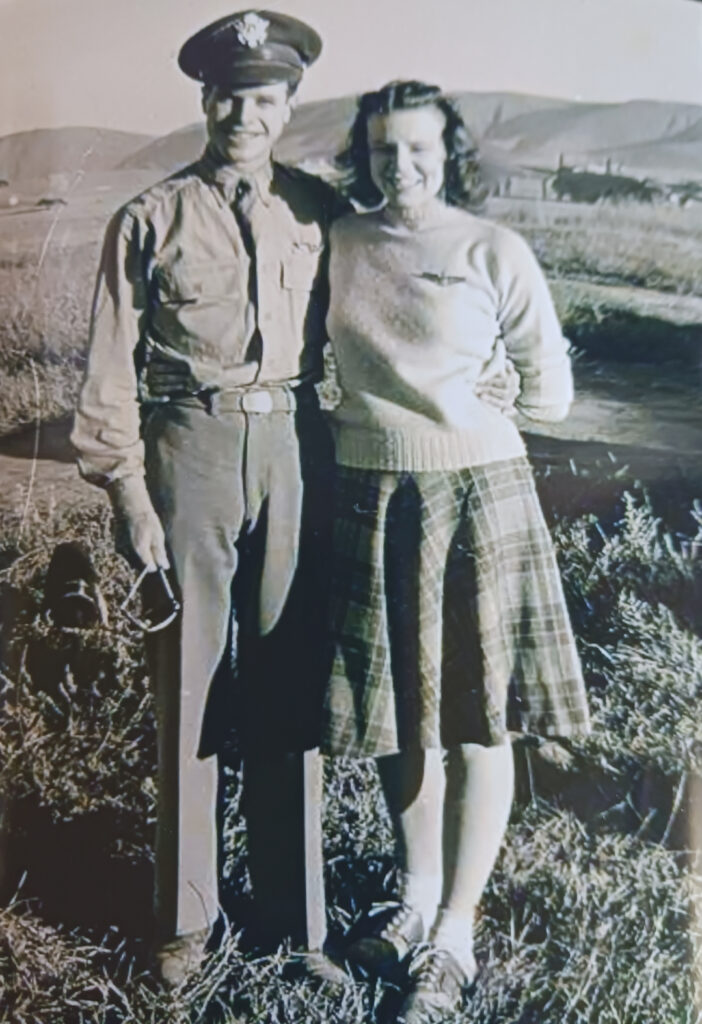 A black-and-white photo of a man and woman standing next to each other in the 1940s.